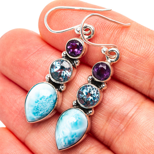 Sterling silver drop earrings with purple amethyst, blue topaz, and larimar cabochons
