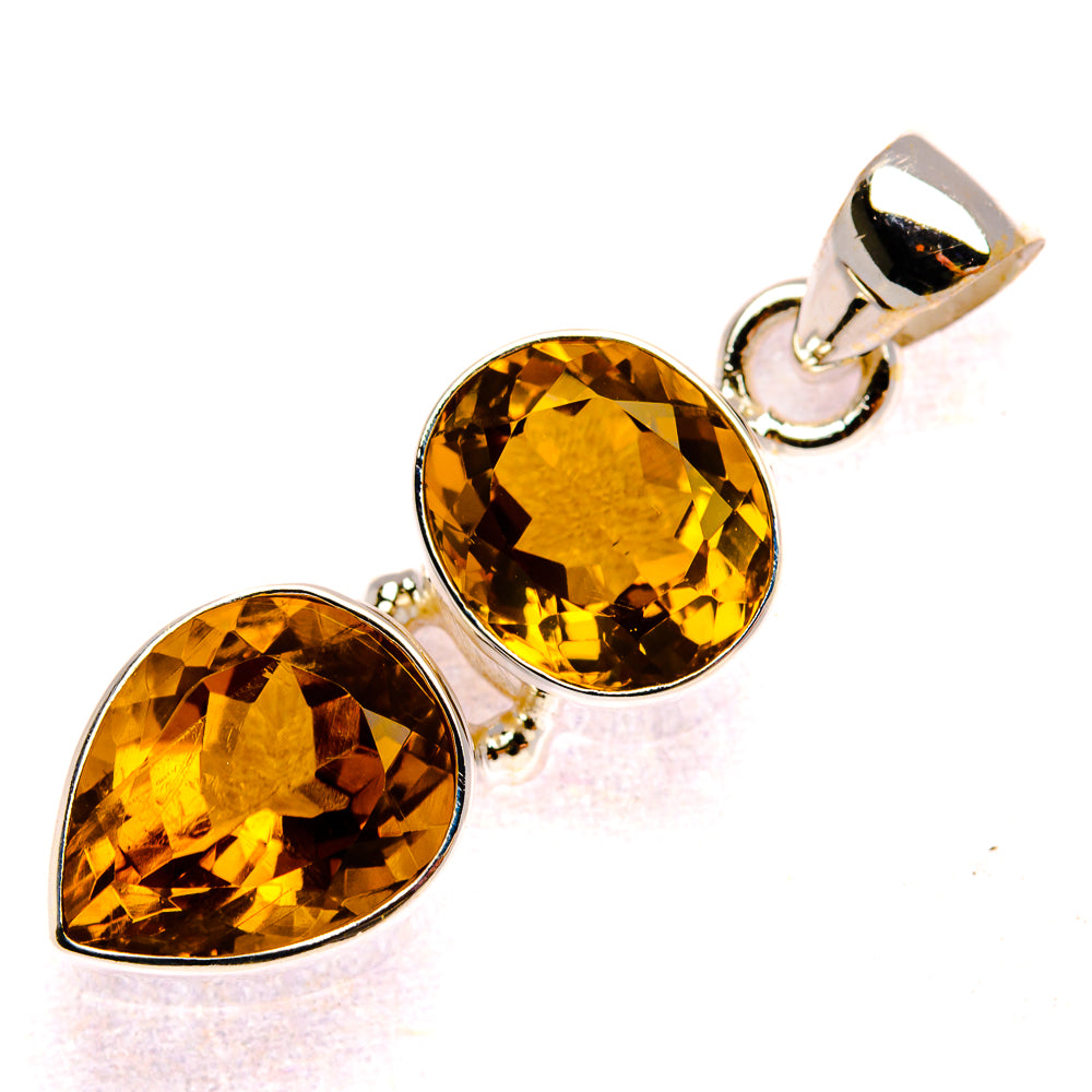 Sterling silver citrine pendant with two faceted pear stones and round bail loop