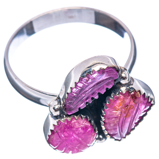 Sterling silver ring with three carved purple ruby stones and side profile prongs