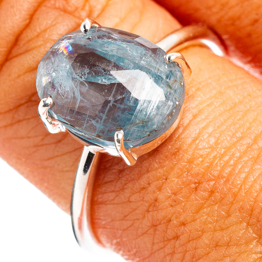 Sterling silver ring with faceted oval aquamarine-blue gemstone and four prongs