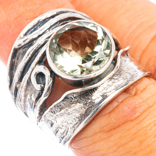 Sterling silver ring with oval green amethyst and swirling filigree band
