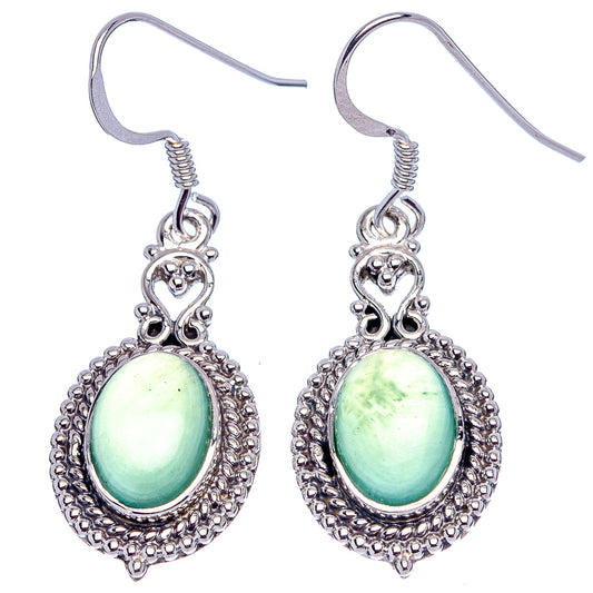 Sterling silver nephrite jade dangle earrings with light green oval cabochons