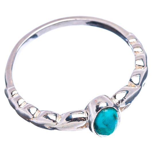 Sterling silver turquoise ring with bezel-set oval stone on faceted band