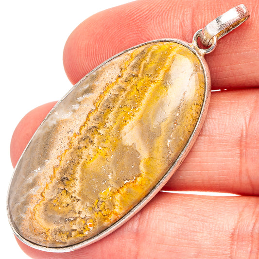 Silver-plated oval bumblebee jasper pendant with yellow veining and top bail loop
