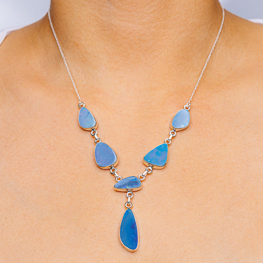 Sterling silver necklace with five blue opal teardrop drops and small links