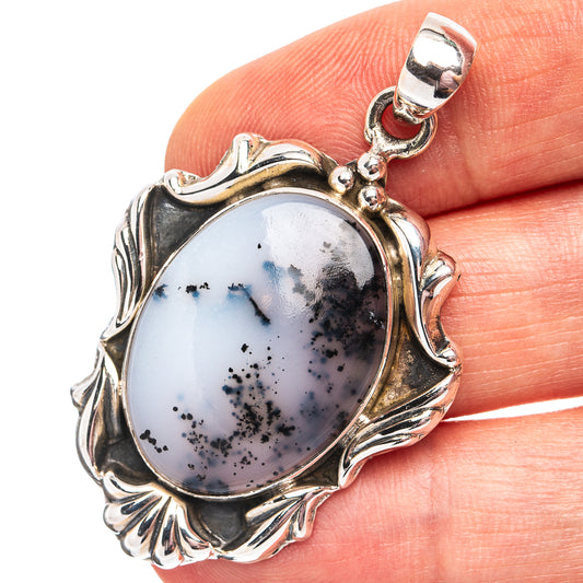 Dendritic agate pendant with oval white stone and black dendrites in ornate sterling silver setting