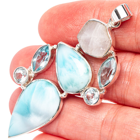 925 sterling silver pendant with blue oval stones and clear round accents