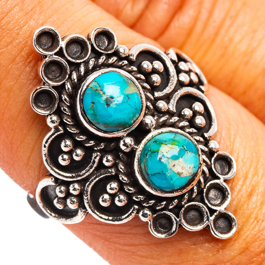 Turquoise cabochon sterling silver ring with ornate filigree and two oval stones