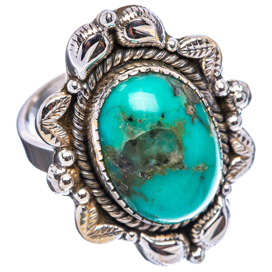 Ornate .925 sterling silver turquoise oval cabochon ring with raised bezel and scrollwork