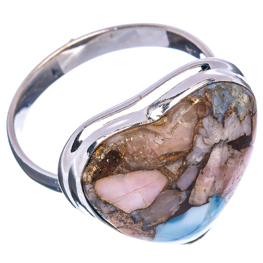 Sterling silver ring with heart setting; side view shows multi-tone stone with blue accents.
