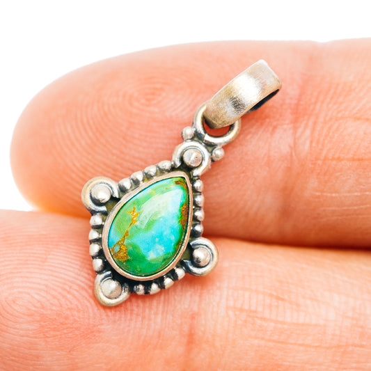 Turquoise teardrop pendant in .925 sterling silver setting with bead borders