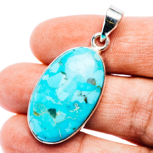 Oval turquoise cabochon pendant in .925 sterling silver with loop bail