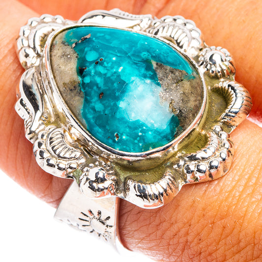 Silver ring with oval turquoise cabochon and ornate rope bezel
