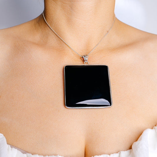 Large black onyx rectangular pendant in sterling silver bezel on a thin chain