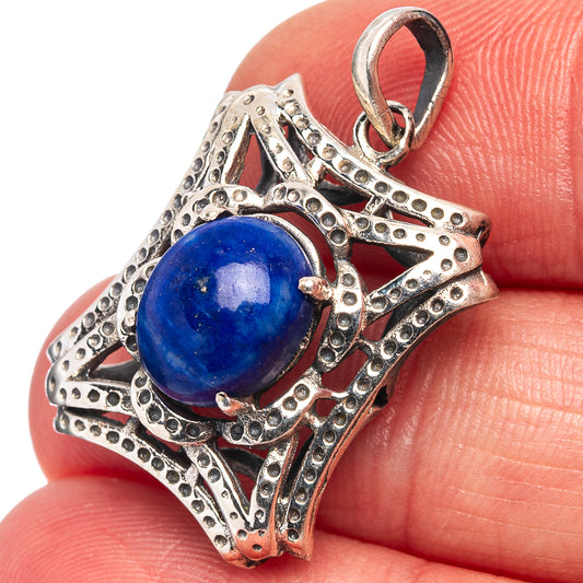 Sterling silver lapis lazuli pendant with blue round gemstone, ornate bezel setting