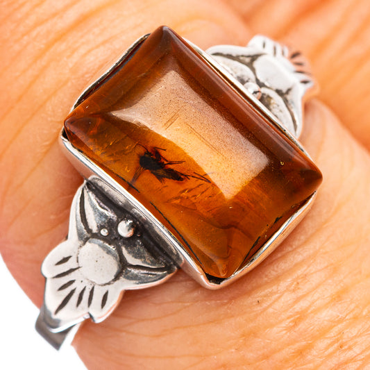Amber insect cabochon ring with .925 sterling silver floral setting, size 8