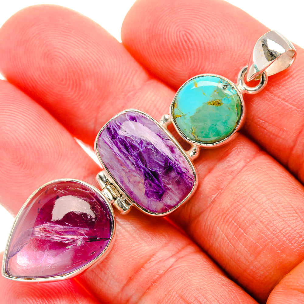 925 sterling silver pendant with three cabochon stones: purple, turquoise, and pink-red.