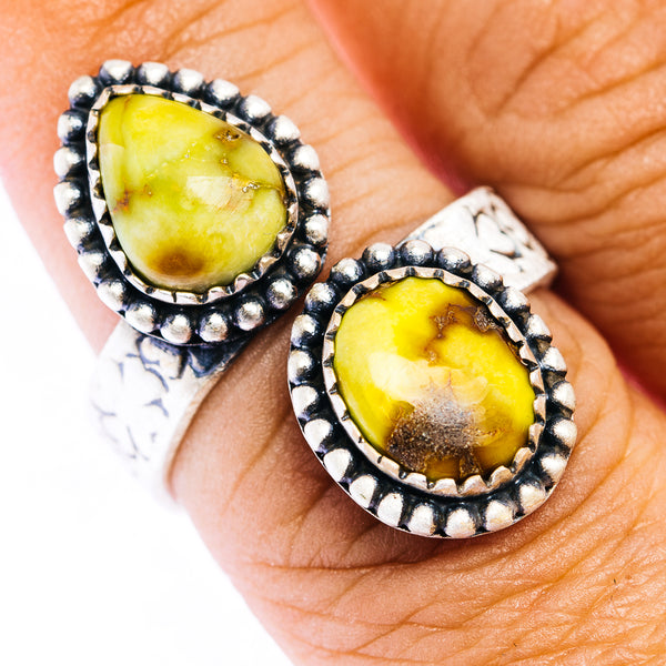 Double-stone sterling silver ring with oval yellow gemstones in beaded bezels
