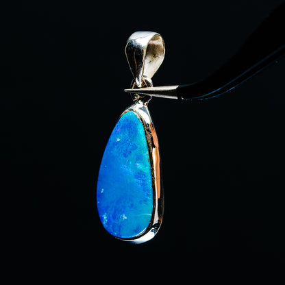 Sterling silver fire opal pendant with blue teardrop stone and side-profile bail