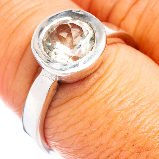 Sterling silver ring with round faceted gemstone bezel setting