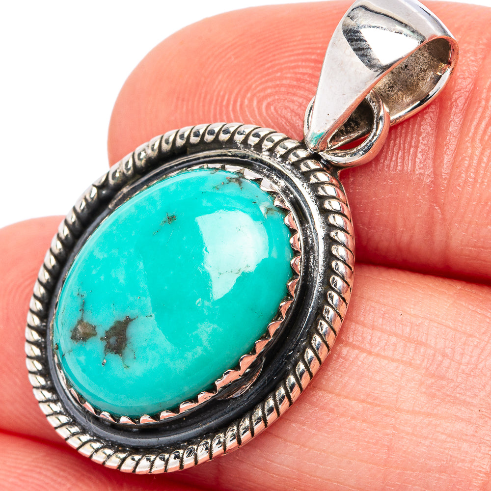 Turquoise oval cabochon pendant, .925 sterling silver bezel with rope border