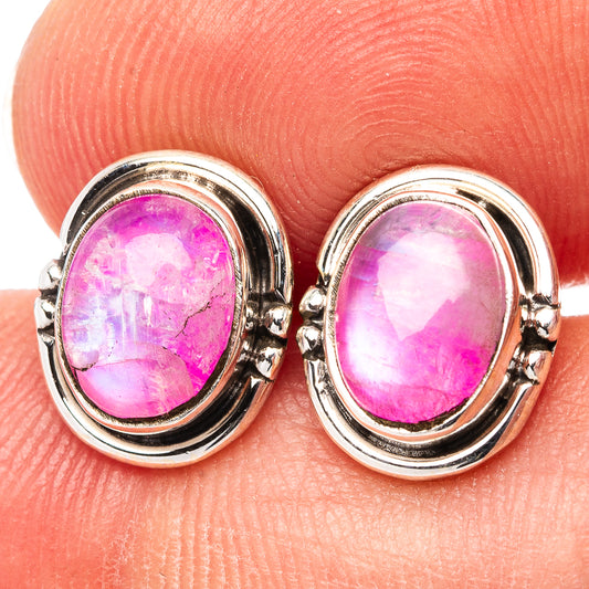 Close-up of oval pink gemstone earrings in .925 sterling silver bezel settings