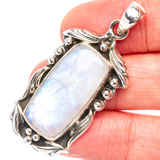 Rainbow moonstone pendant close-up: .925 sterling silver bail and ornate bezel border.