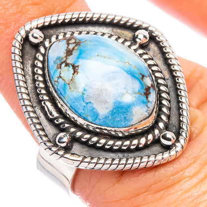 Turquoise oval stone bezel set in dark silver Native-style ring, adjustable band