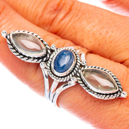 925 sterling silver three-stone ring with blue oval center and two oval clear stones