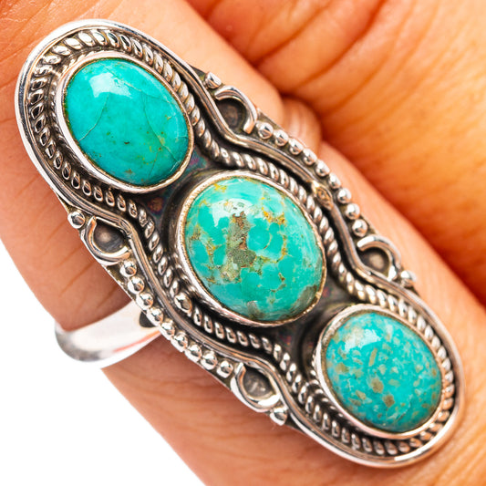 Turquoise cabochon ring with three oval stones, ornate .925 sterling silver bezel.