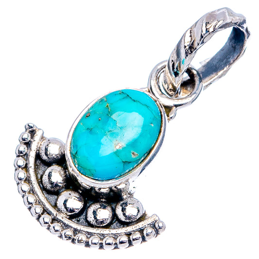Oval turquoise cabochon pendant in .925 sterling silver with ornate bail and frame