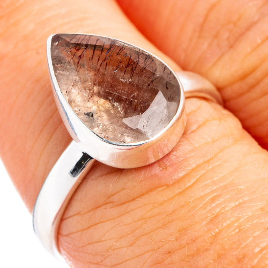 Sterling silver ring with teardrop purple-brown cabochon stone