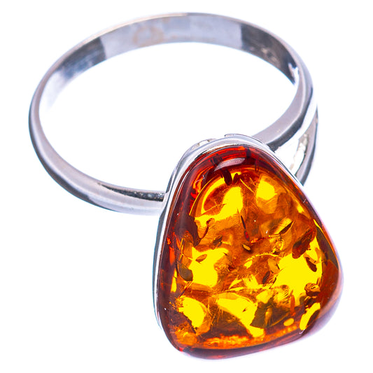 Golden amber teardrop ring with shiny silver band and bezel setting.