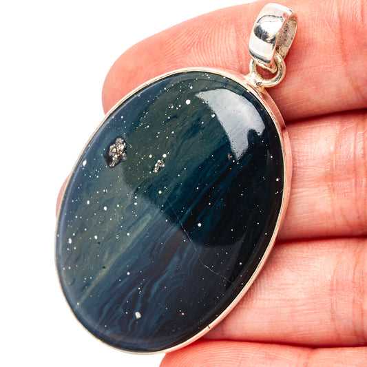 Oval sterling silver pendant with blue slag stone, glittery speckles, round bail