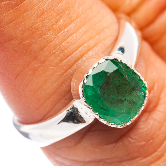 Sterling silver ring with oval faceted green emerald bezel setting