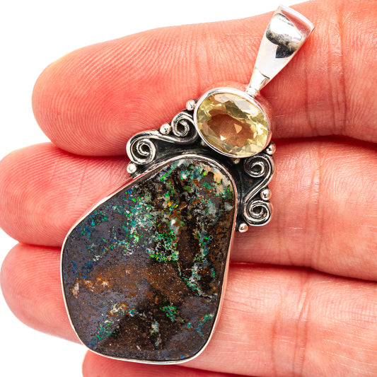 Sterling silver boulder opal and lemon quartz pendant with ornate scroll bezel