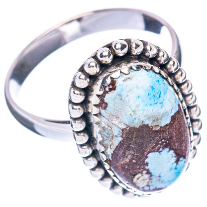 Turquoise oval sterling silver ring, round beaded edge around raised stone.