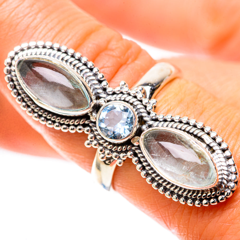 Sterling silver beaded oval halo ring with two light blue-green stones and round blue centerpiece