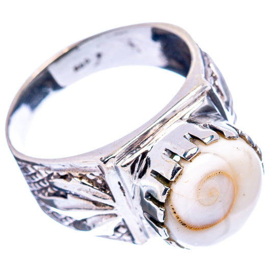 Sterling silver filigree ring with oval white cabochon and engraved wrap on band