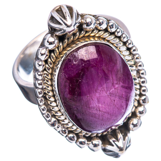 Sterling silver statement ring with oval purple cabochon and ornate side details