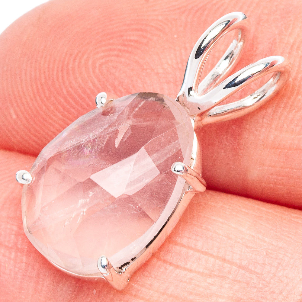 Rose quartz teardrop pendant with faceted gem and silver prong setting