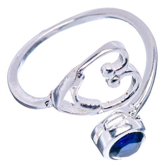 Heart-shaped 925 sterling silver ring with blue stone bezel and openwork band