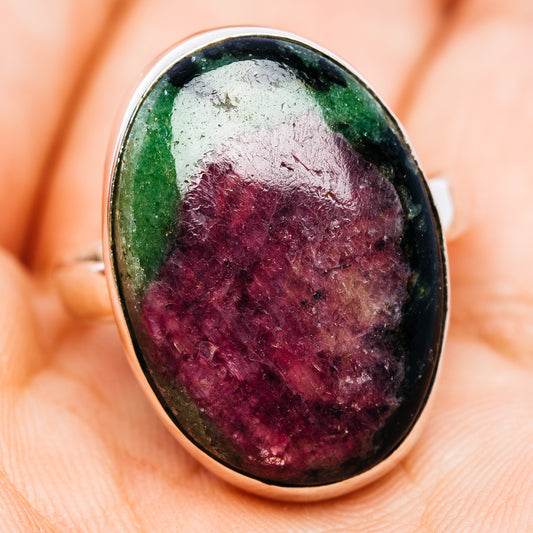 Oval ruby zoisite ring with a polished sterling silver bezel and purple and green stone