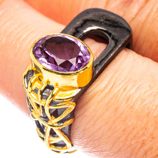 Amethyst gemstone ring with black rhodium look, purple oval stone and gold ornate setting