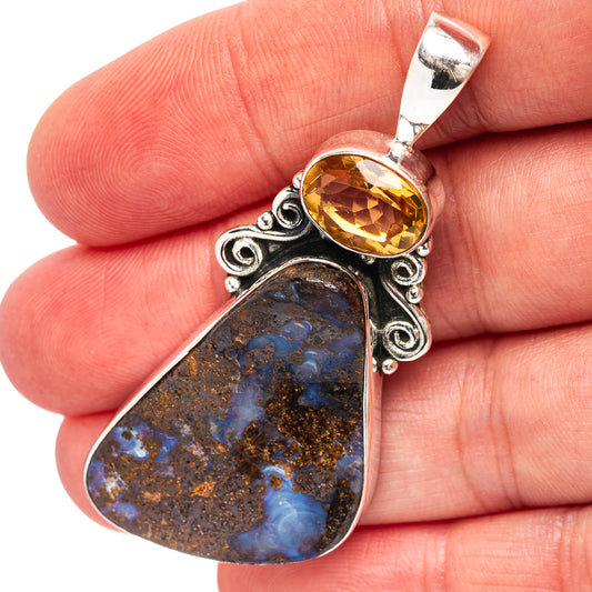 Sterling silver pendant with oval boulder opal and citrine center stone, loop bail