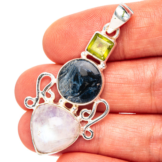 Sterling silver pendant with oval dark blue and pale pink stones, plus green square top