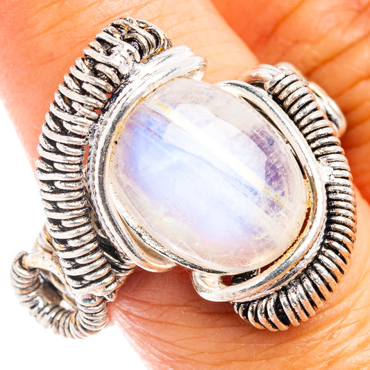 Sterling silver oval moonstone ring with rope bezel and rainbow shimmer