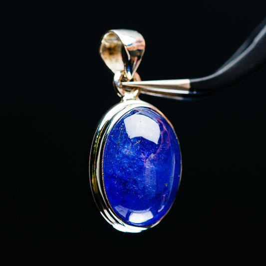 Blue oval gemstone pendant in .925 sterling silver oval frame with top bail, glossy finish