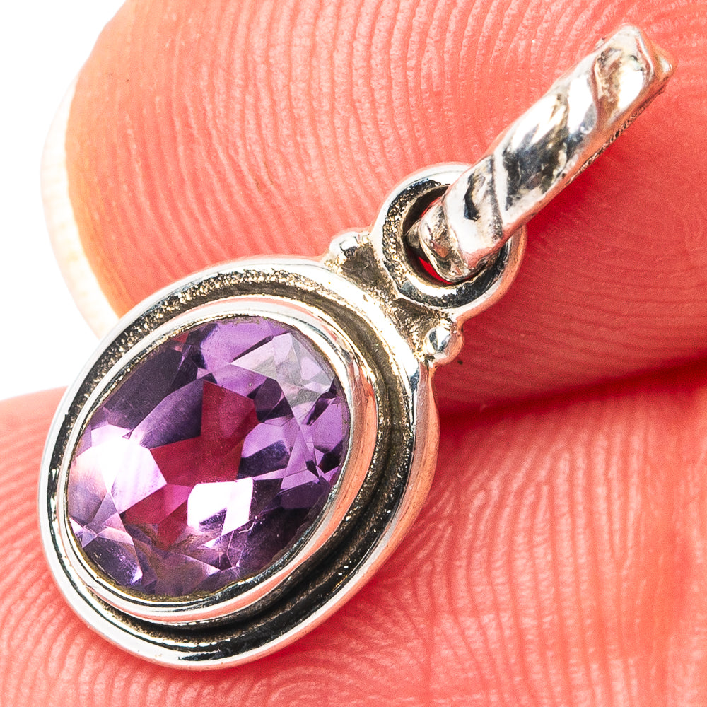 Sterling silver amethyst pendant with oval purple gemstone bezel