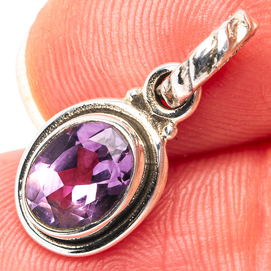 Sterling silver amethyst pendant with oval purple gemstone bezel